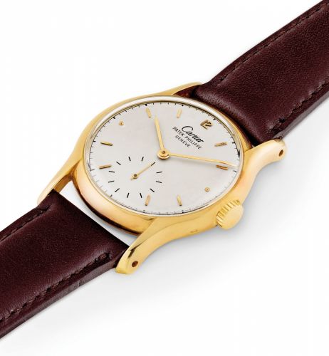 PATEK PHILIPPE. A FINE AND VERY RARE 18K GOLD WRISTWATCH RETAILED BY CARTIER/bb