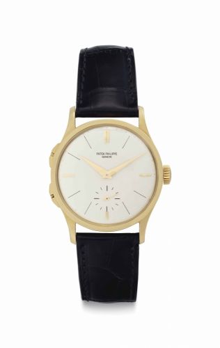 Patek Philippe. A Fine and Rare 18k Gold Dual Time Zone Wristwatch