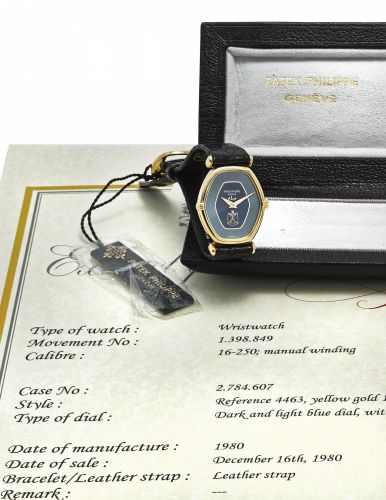 PATEK PHILIPPE. A RARE 18K GOLD WRISTWATCH WITH IRAQI COAT OF ARMS, CERTIFICATE, TAG AND BOX/bb