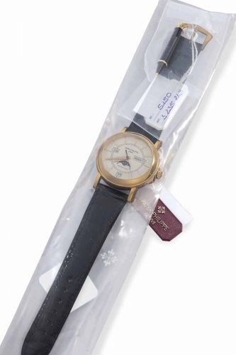Patek Philippe. A Very Rare 18k Pink Gold Limited Edition Automatic Annual Calendar Wristwatch with Moon Phases and Center Seconds