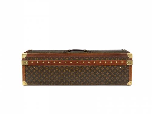 A CLASSIC MONOGRAM LIBRARY TRUNK MADE FOR THE ENCYCLOPAEDIA BRITANNICA MODIFIED AS A HUMIDOR, WITH BRASS HARDWARE, AFTER-MARKET