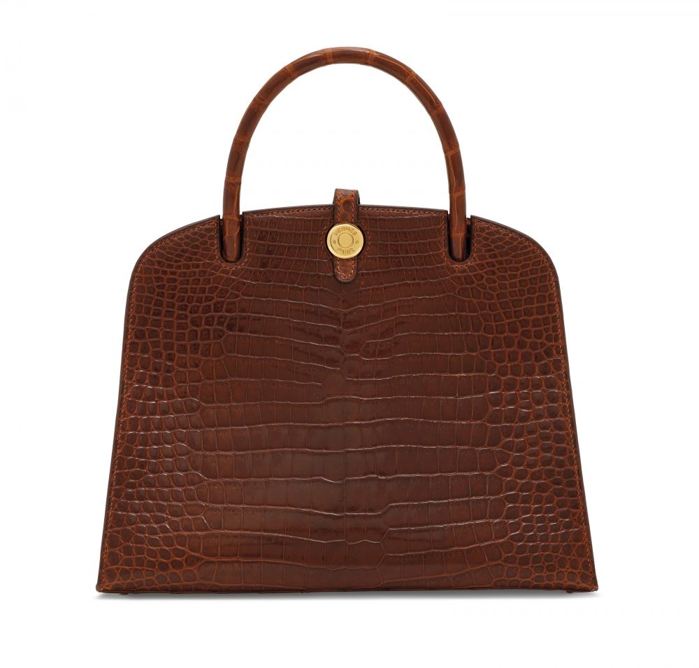 A SHINY ÉTRUSQUE POROSUS CROCODILE DALVY 25 WITH GOLD HARDWARE