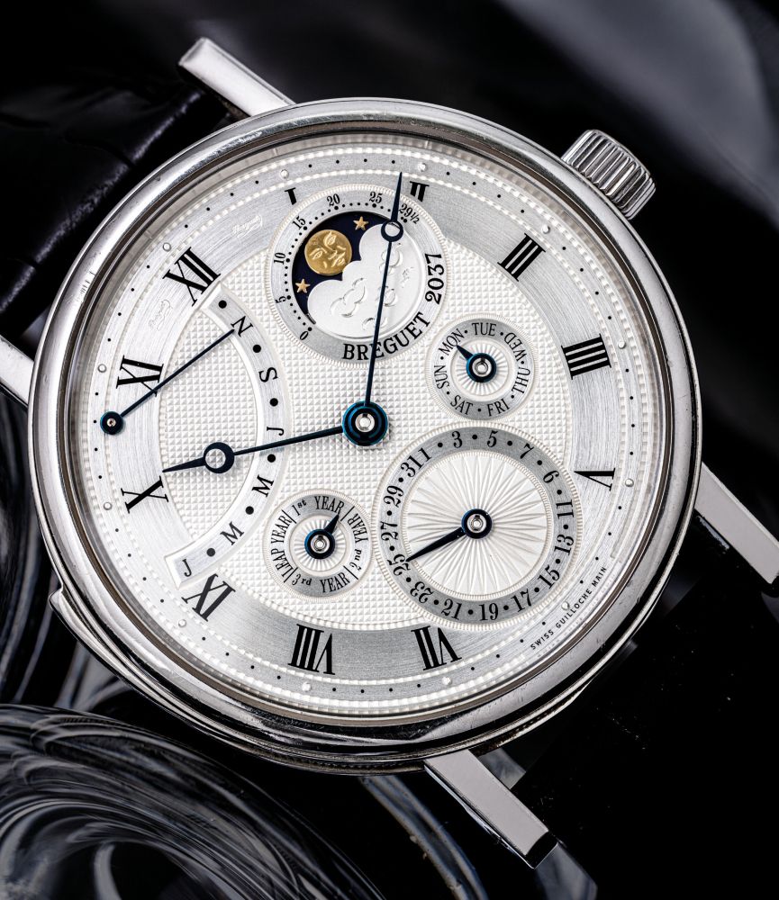 BREGUET. A VERY FINE AND RARE PLATINUM MINUTE REPEATING PERPETUAL CALENDAR WRISTWATCH WITH RETROGRADE MONTH, LEAP YEAR INDICATION AND MOON PHASES