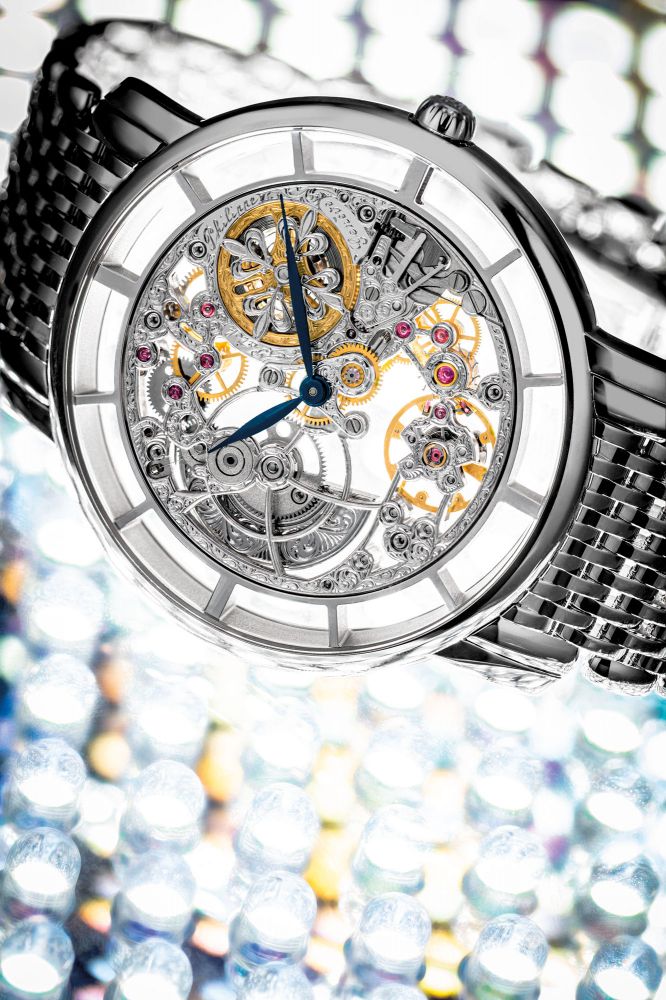 PATEK PHILIPPE. AN 18K WHITE GOLD SKELETONISED AUTOMATIC WRISTWATCH WITH BRACELET