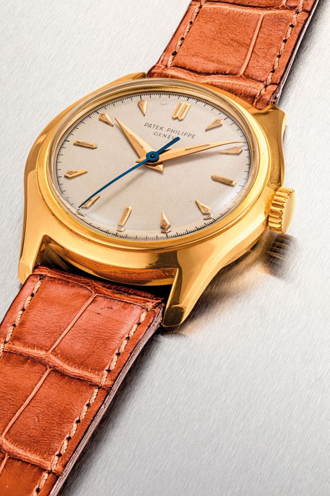 PATEK PHILIPPE. AN 18K GOLD WRISTWATCH WITH SWEEP CENTRE SECONDS