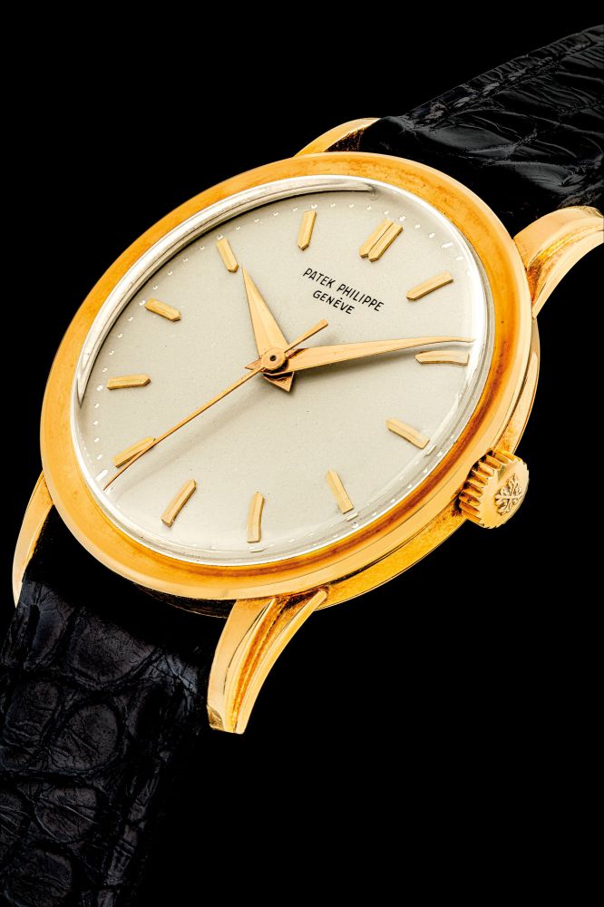 PATEK PHILIPPE. AN 18K GOLD WRISTWATCH WITH SWEEP CENTRE SECONDS