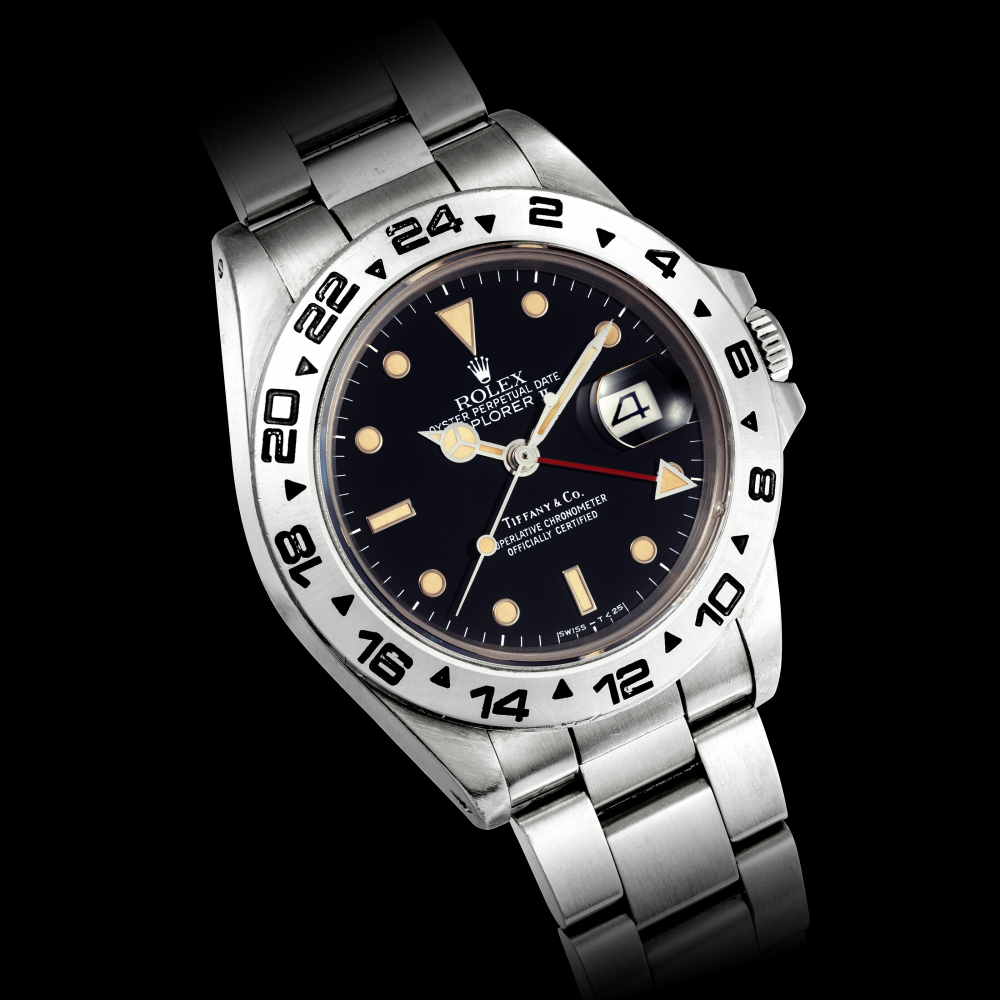 ROLEX. A RARE STAINLESS STEEL AUTOMATIC DUAL TIME WRISTWATCH WITH SWEEP CENTRE SECONDS DATE AND BRACELET RETAILED BY TIFFANY & CO.