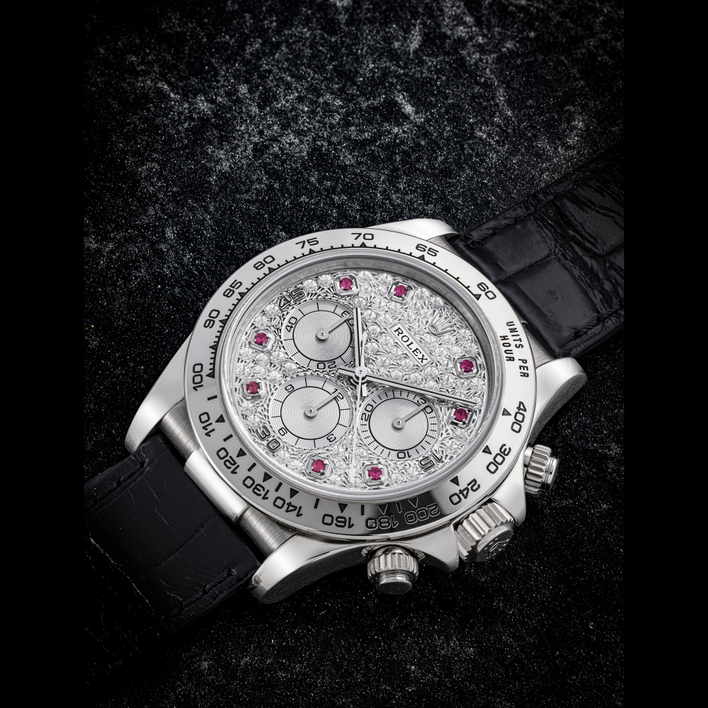 ROLEX. AN 18K WHITE GOLD RUBY AND DIAMOND-SET AUTOMATIC CHRONOGRAPH WRISTWATCH