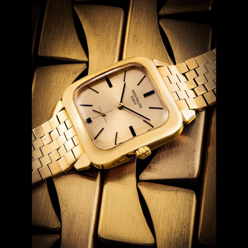 PATEK PHILIPPE. A VERY RARE 18K PINK GOLD AUTOMATIC SQUARE WRISTWATCH WITH PINK DIAL BLACK INDEXES AND BRACELET