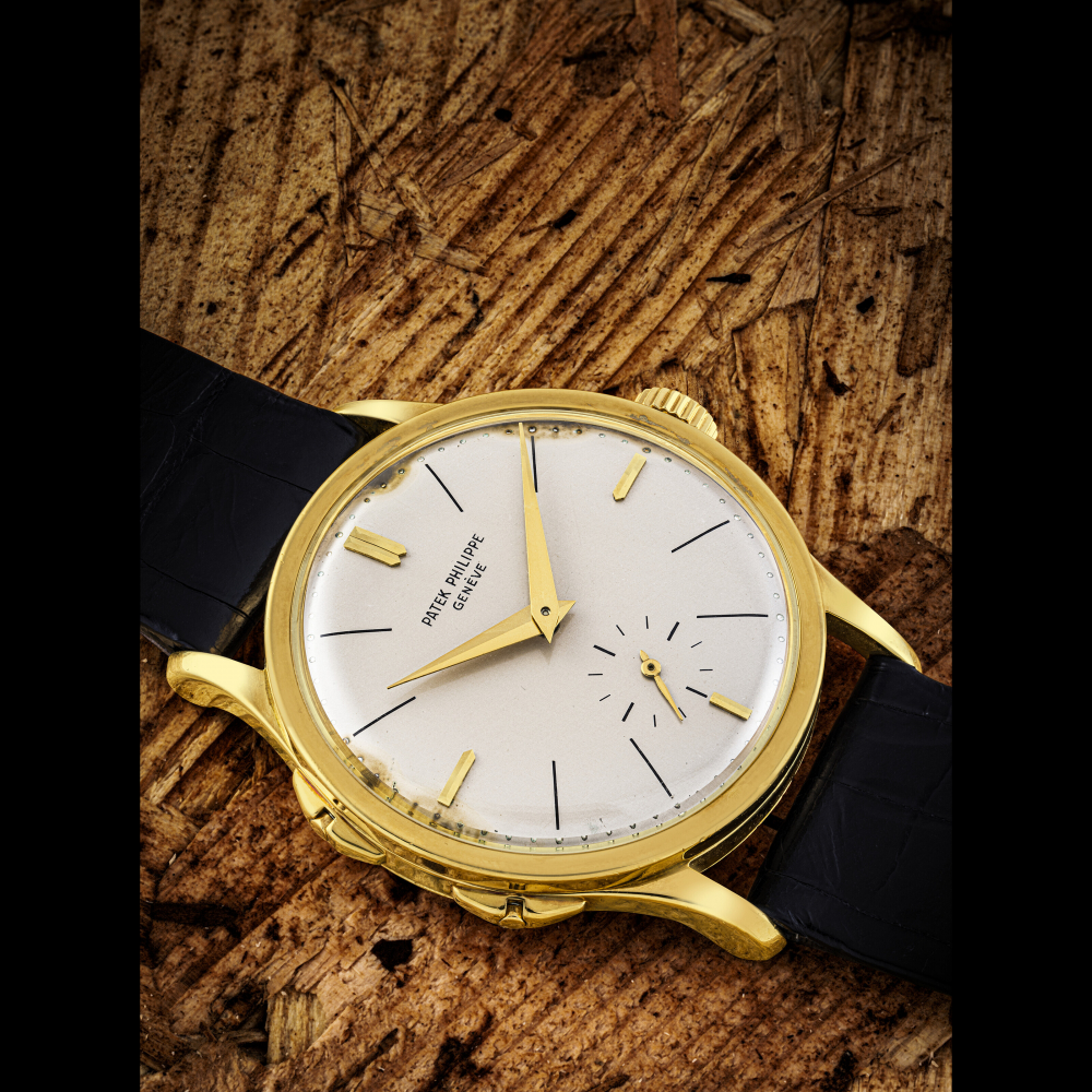 PATEK PHILIPPE. A VERY RARE 18K GOLD WRISTWATCH WITH ADJUSTABLE HOUR HAND