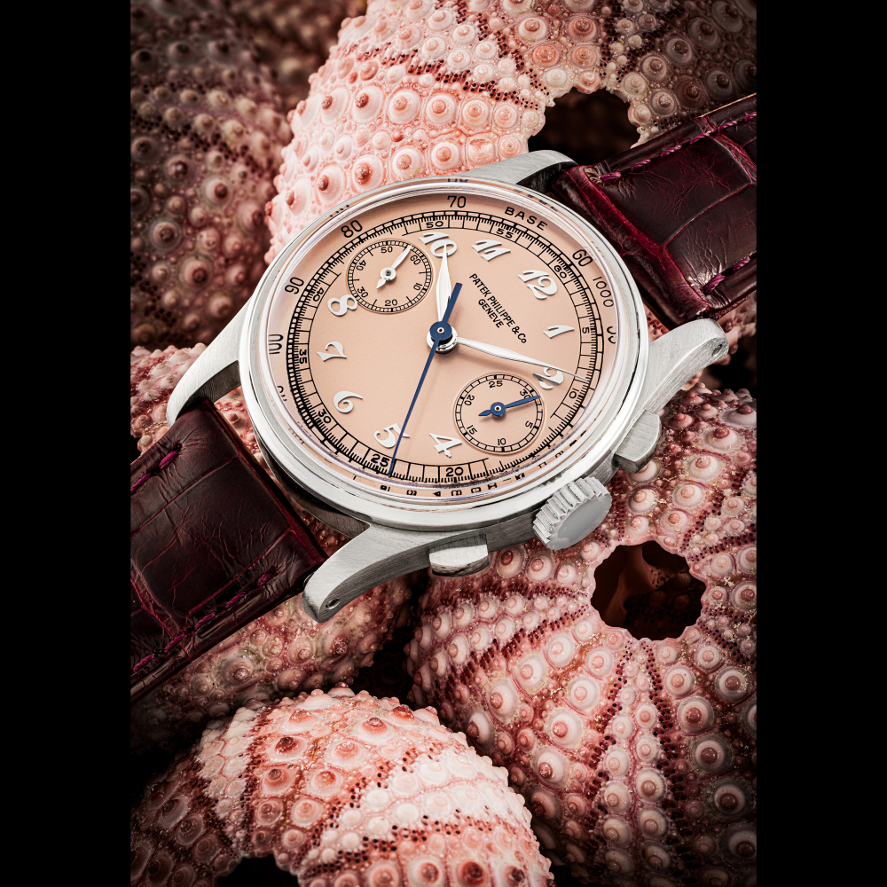 PATEK PHILIPPE. AN EXCEPTIONALLY ATTRACTIVE AND VERY RARE STAINLESS STEEL CHRONOGRAPH WRISTWATCH WITH PINK DIAL AND BREGUET NUMERALS