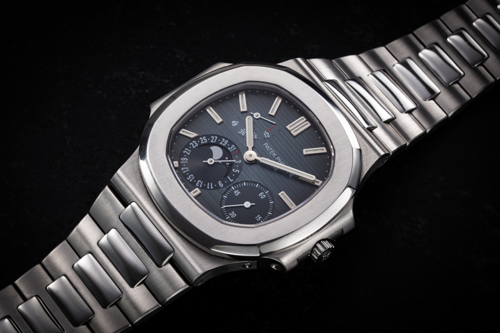 PATEK PHILIPPE, NAUTILUS REF. 3712/1A-001 'FIRST SERIES', A RARE STEEL AUTOMATIC WRISTWATCH WITH MOON PHASE AND POWER RESERVE - CASE