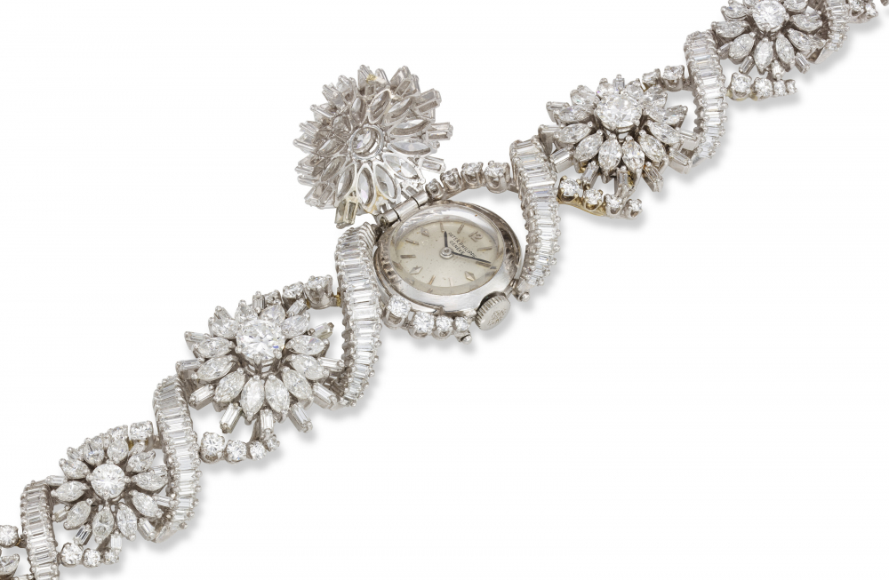 PATEK PHILIPPE, REF. 3215/39, AN EXTREMELY RARE AND IMPRESSIVE PLATINUM AND DIAMOND-SET BRACELET WATCH WITH HINGED COVER, THE ONLY KNOWN EXAMPLE