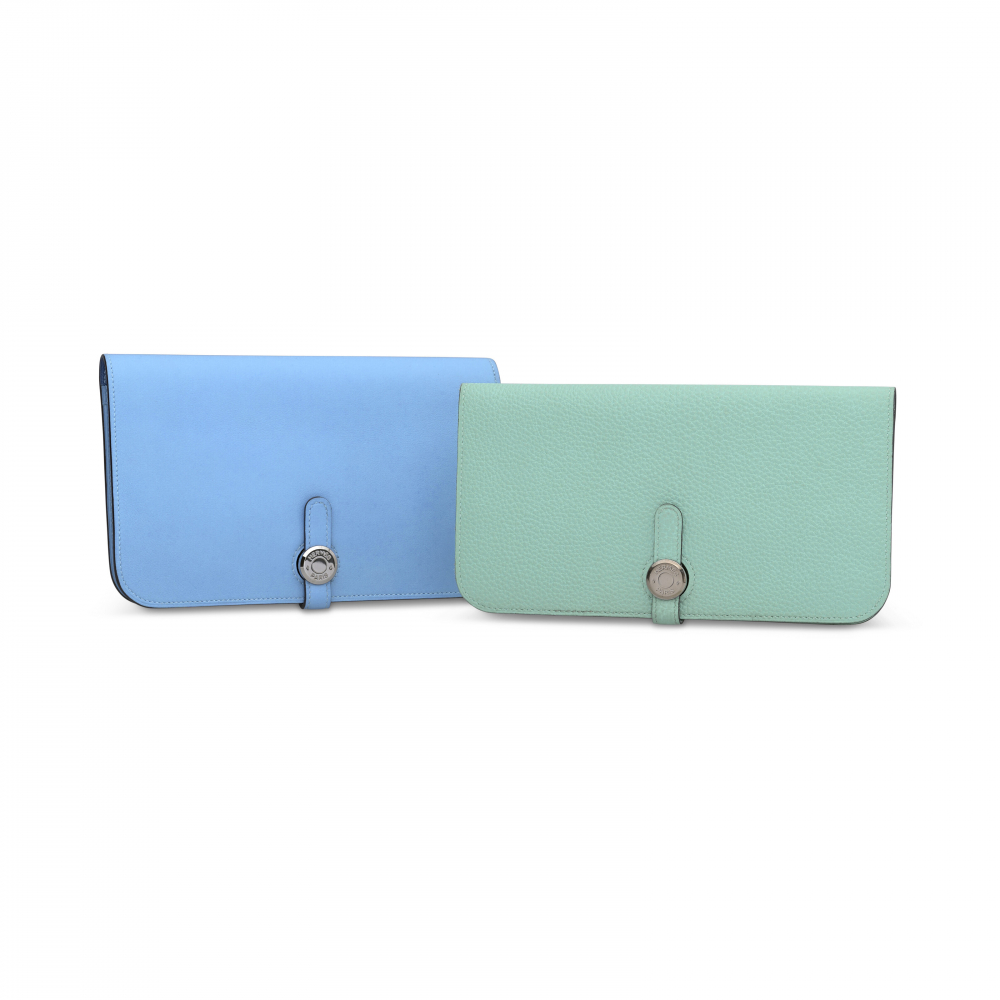 A SET OF TWO: A BLEU PARADIS & BLEU FRANCE SWIFT LEATHER DOGON DUO WALLET WITH PALLADIUM HARDWARE & A BLEU ATOLL TOGO LEATHER DOGON WALLET WITH PALLADIUM HARDWARE - HERMÈS