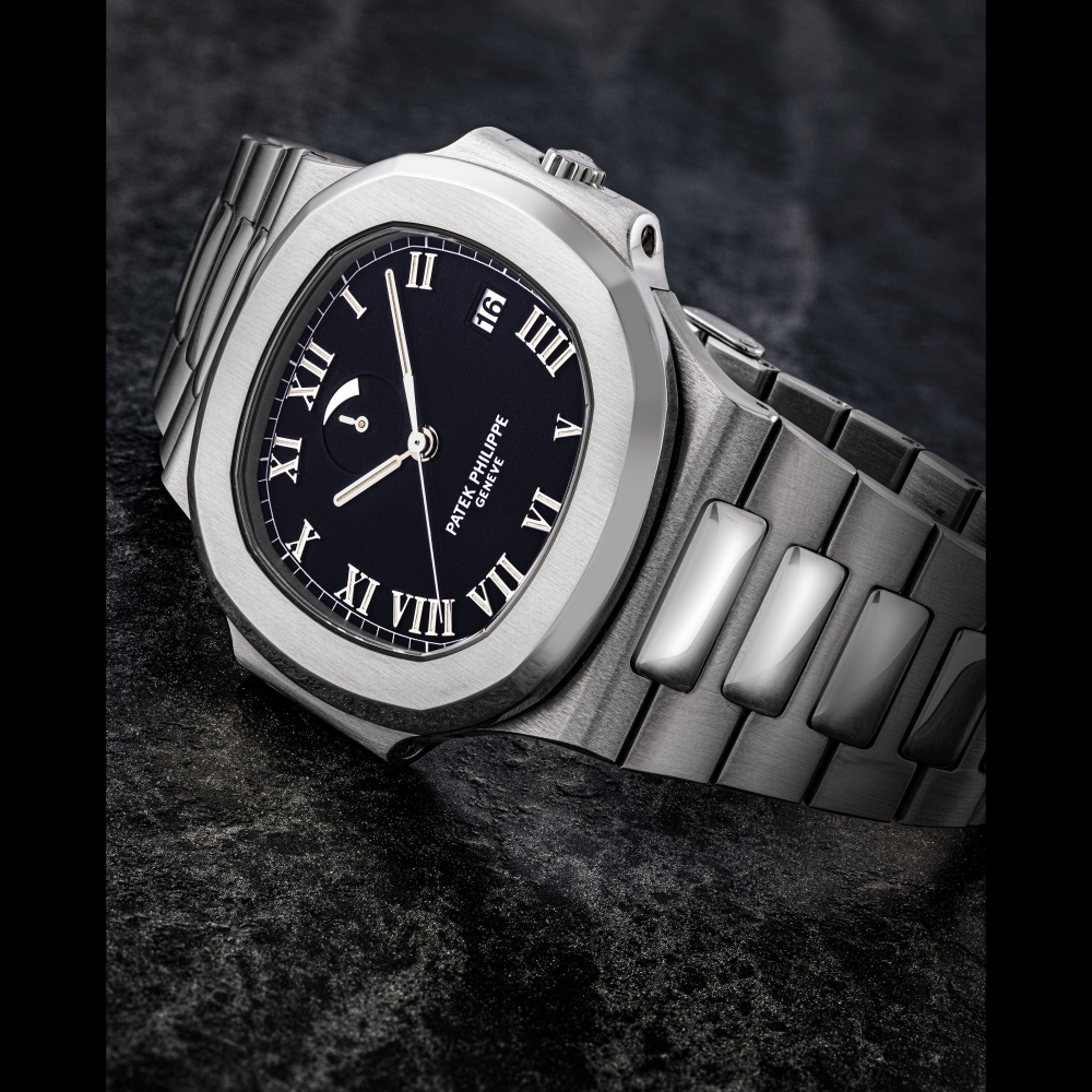 PATEK PHILIPPE. A STAINLESS STEEL AUTOMATIC WRISTWATCH WITH SWEEP CENTRE SECONDS, DATE, POWER RESERVE AND BRACELET