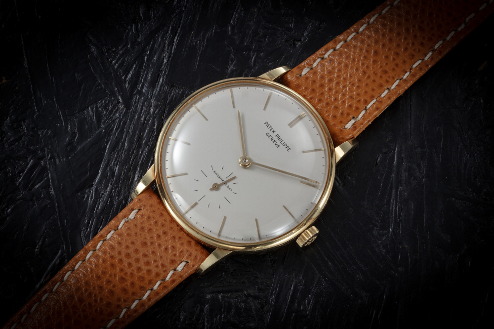 PATEK PHILIPPE, REF. 3410, A FINE GOLD MANUAL-WINDING WRISTWATCH RETAILED BY HAUSMANN & CO. 