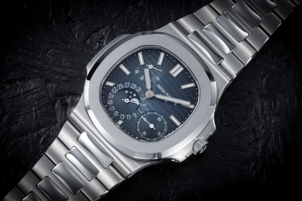 PATEK PHILIPPE, NAUTILUS REF. 5712/A-001, A FINE STEEL AUTOMATIC WRISTWATCH WITH MOON-PHASE AND BRACELET