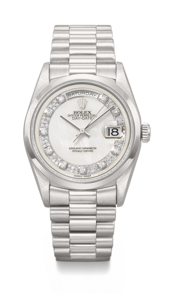 ROLEX. A RARE AND DAZZLING PLATINUM AND DIAMOND-SET AUTOMATIC WRISTWATCH WITH SWEEP CENTRE SECONDS, DAY, DATE, MOTHER-OF-PEARL DIAL AND BRACELET
