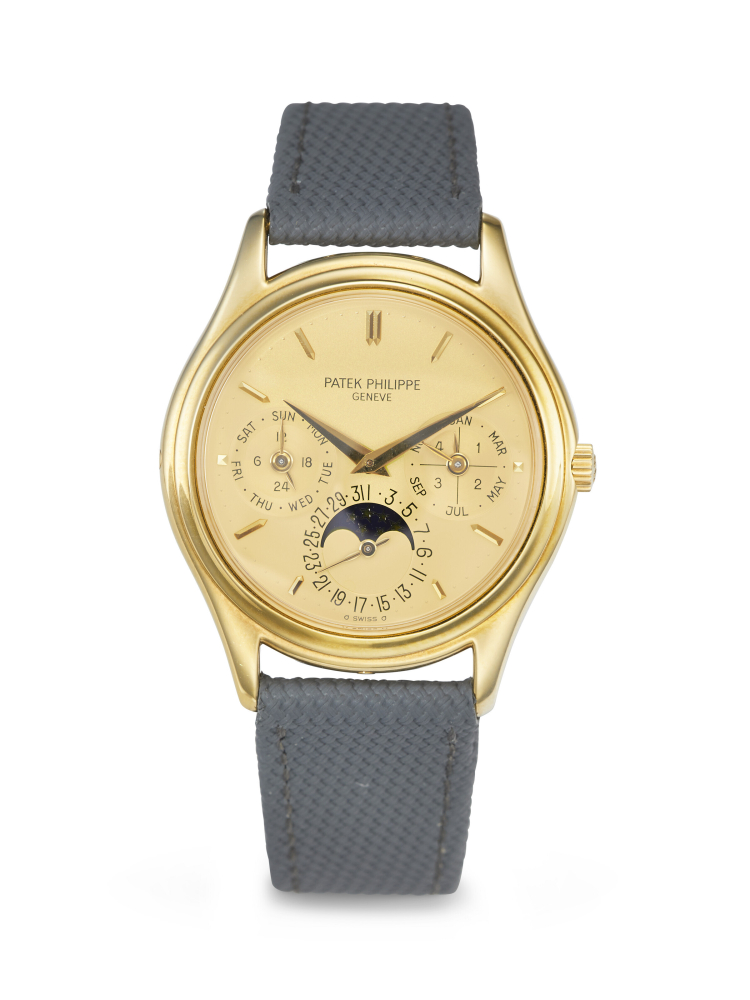 PATEK PHILIPPE. AN EXTREMELY RARE AND HIGHLY COVETED 18K GOLD AUTOMATIC PERPETUAL CALENDAR WRISTWATCH WITH MOON PHASES AND ‘GILT’ DIAL