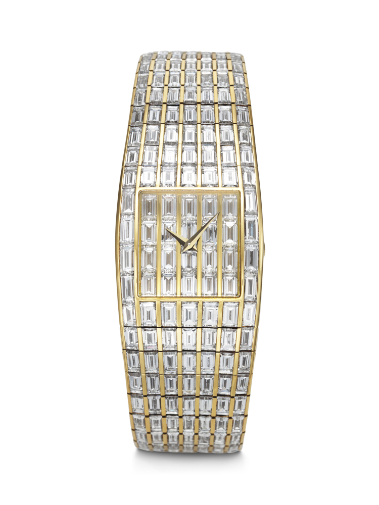 PIAGET. A MESMERIZING AND HIGHLY IMPRESSIVE 18K GOLD AND BAGUETTE DIAMOND-SET QUARTZ BRACELET WATCH