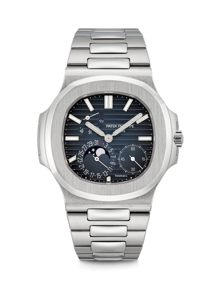 PATEK PHILIPPE. AN EXTREMELY RARE STAINLESS STEEL AUTOMATIC WRISTWATCH WITH MOON PHASES, DATE, POWER RESERVE AND BRACELET, RETAILED BY TIFFANY & CO. 