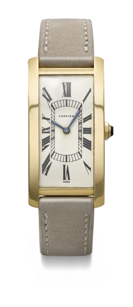 CARTIER. AN EXTREMELY RARE, ELEGANT AND LARGE RECTANGULAR CURVED 18K GOLD WRISTWATCH