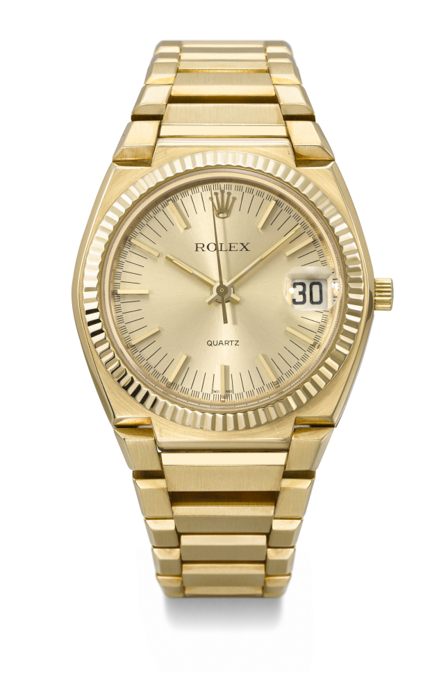 ROLEX. A RARE AND HEAVY 18K GOLD QUARTZ TONNEAU-SHAPED WRISTWATCH WITH SWEEP CENTRE SECONDS, DATE AND BRACELET