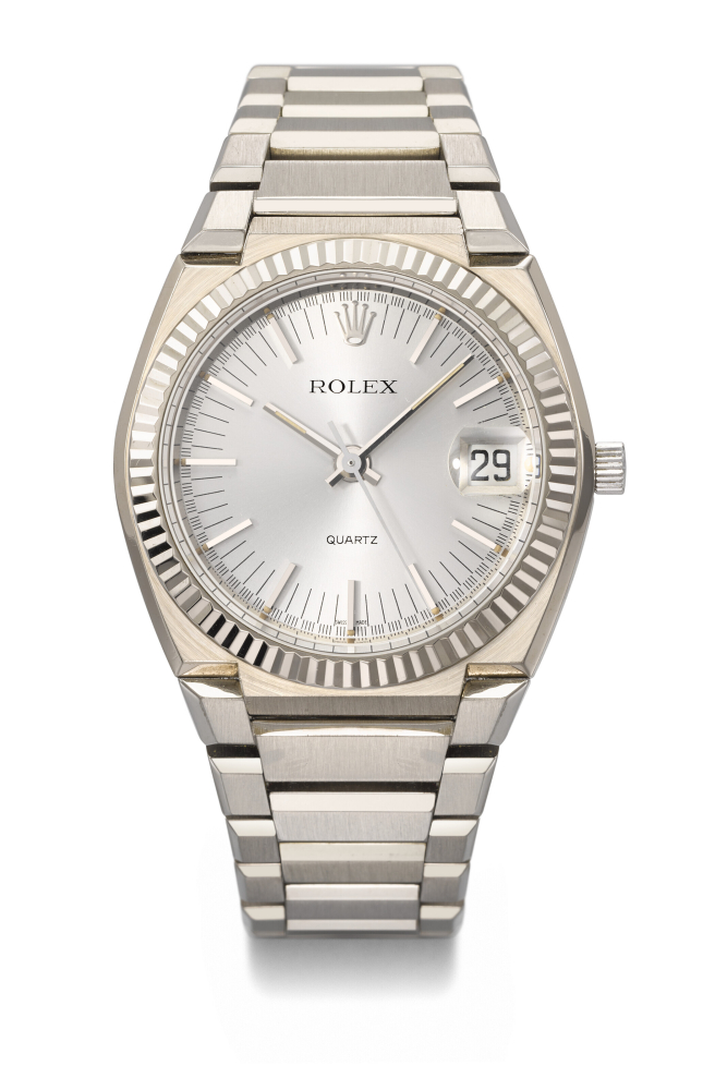 ROLEX. AN EXTREMELY RARE 18K WHITE GOLD QUARTZ TONNEAU-SHAPED WRISTWATCH WITH SWEEP CENTRE SECONDS, DATE AND BRACELET