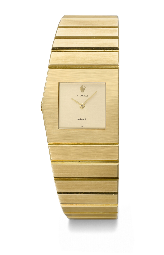 ROLEX. A RARE AND HEAVY 18K GOLD ASYMMETRIC LEFT-HAND WINDING WRISTWATCH WITH INTEGRAL 18K GOLD ROLEX ‘KING MIDAS’ BRACELET