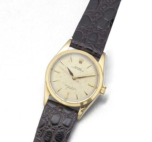 ROLEX: A STEEL AND GILT AUTOMATIC WRISTWATCH WITH CENTRE SECONDS.signed Rolex, Oyster Perpetual, Officially Certified Chronometer, Ref:6634, circa 1960.