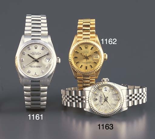 ROLEX. A MID-SIZED PLATINUM AND DIAMOND-SET SELF-WINDING WRISTWATCH WITH SWEEP CENTRE SECONDS, DATE AND BRACELET