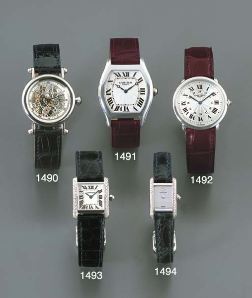 CARTIER. A FINE AND RARE LIMITED EDITION PLATINUM SKELETONISED WRISTWATCH
