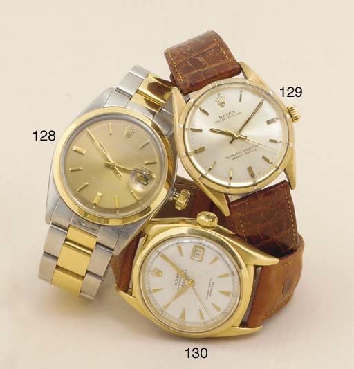 Rolex. An Early 18ct Gold Automatic Calendar Centre Seconds Wristwatch