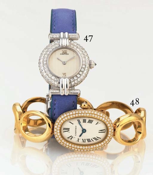 CARTIER. A LADY'S 18K GOLD AND DIAMOND OVAL WRISTWATCH WITH BRACELET