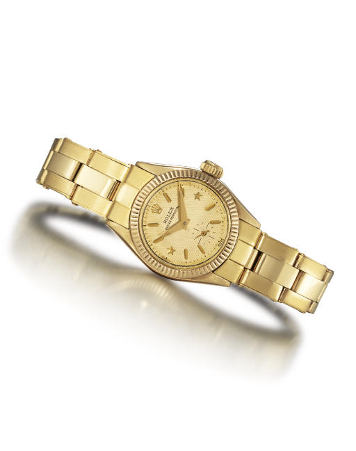 ROLEX. A VERY RARE LADY'S 14K GOLD AUTOMATIC WRISTWATCH WITH BRACELET AND STAR NUMERALS