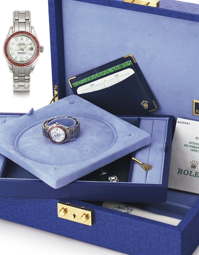ROLEX. A LADY'S 18K WHITE GOLD, PINK SAPPHIRE AND MOTHER-OF-PEARL AUTOMATIC WRISTWATCH WITH DATE, CENTER SECONDS AND BRACELET
