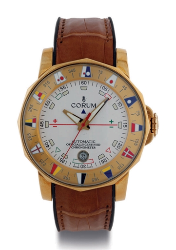 CORUM. A FINE OVERSIZED 18K GOLD DODECAHEDRAL AUTOMATIC WRISTWATCH WITH CENTER SECONDS, DATE AND TIME INDICAITON