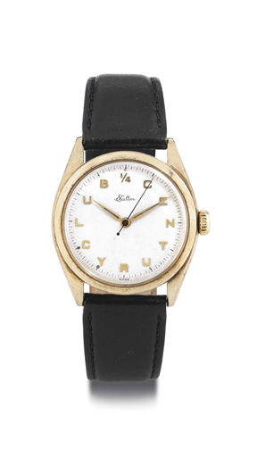 ROLEX. A 14K GOLD WRISTWATCH WITH CENTER SECONDS