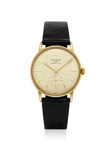PATEK PHILIPPE. AN 18K GOLD AUTOMATIC WRISTWATCH, RETAILED BY TIFFANY & CO.
