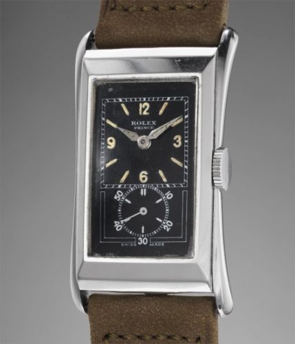 Rolex Follow;Ref. 1490;A fine and rare stainless steel rectangular wristwatch with black lacquer dial, luminous hour markers and hands