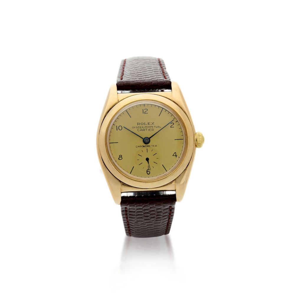 ROLEX | REFERENCE 3130 OYSTER PERPETUAL 'BUBBLEBACK' RETAILED BY CARTIER: A YELLOW GOLD AUTOMATIC WRISTWATCH, CIRCA 1940