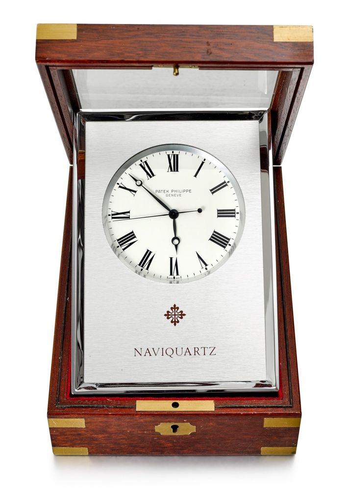 PATEK PHILIPPE | REFERENCE E1200, AN ALUMINUM TABLE CLOCK WITH FITTED WOODEN CASE, CIRCA 1970