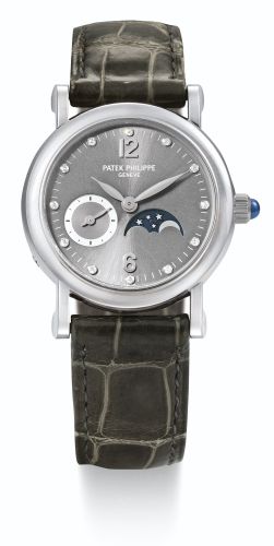 Patek Philippe.A LADY'S WHITE GOLD AND DIAMOND-SET WRISTWATCH WITH MOON-PHASES AND DIAMOND-SET INDEXES REF 4857G MVT 3115276 CASE 4128369 CIRCA 2001