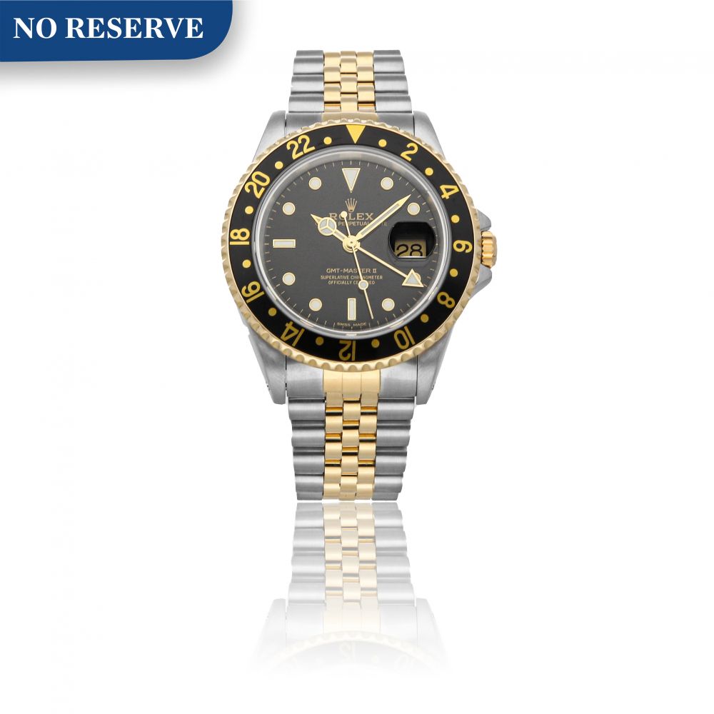 ROLEX | GMT-MASTER II REF 16713, A STAINLESS STEEL AND YELLOW GOLD AUTOMATIC DUAL TIME ZONE WRISTWATCH WITH DATE AND BRACELET CIRCA 1995