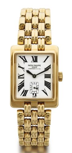 Patek Philippe RETAILED BY TIFFANY & CO.: A YELLOW GOLD WRISTWATCH WITH BRACELET REF 5010/1 MVT 1846955 CASE 2967510 GONDOLO MADE IN 1995