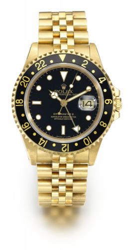 Rolex A YELLOW GOLD AUTOMATIC SWEEP SECONDS DUAL TIME ZONE WRISTWATCH WITH DATE AND BRACELET REF 16718 CASE R882505 GMT-MASTER II CIRCA 1988