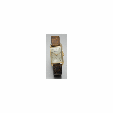 A FINE AND RARE PINK GOLD CURVED RECTANGULAR WRISTWATCH, PATEK PHILIPPE & CO., GEN