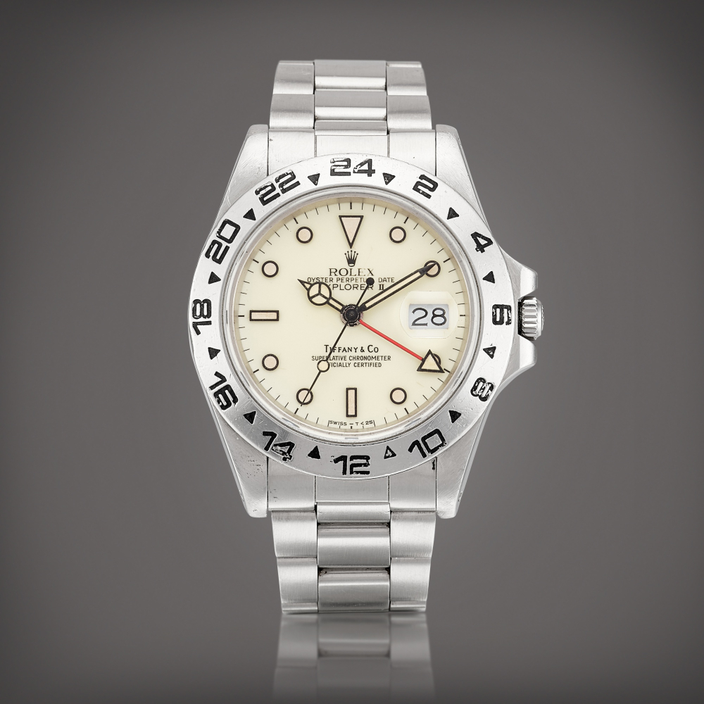 PROPERTY FROM AN ESTEEMED COLLECTOR  Rolex  Explorer II, Reference 16550 A stainless steel wristwatch with 24 hours indication, date, cream dial and bracelet, Retailed by Tiffany & Co., Circa 1987 