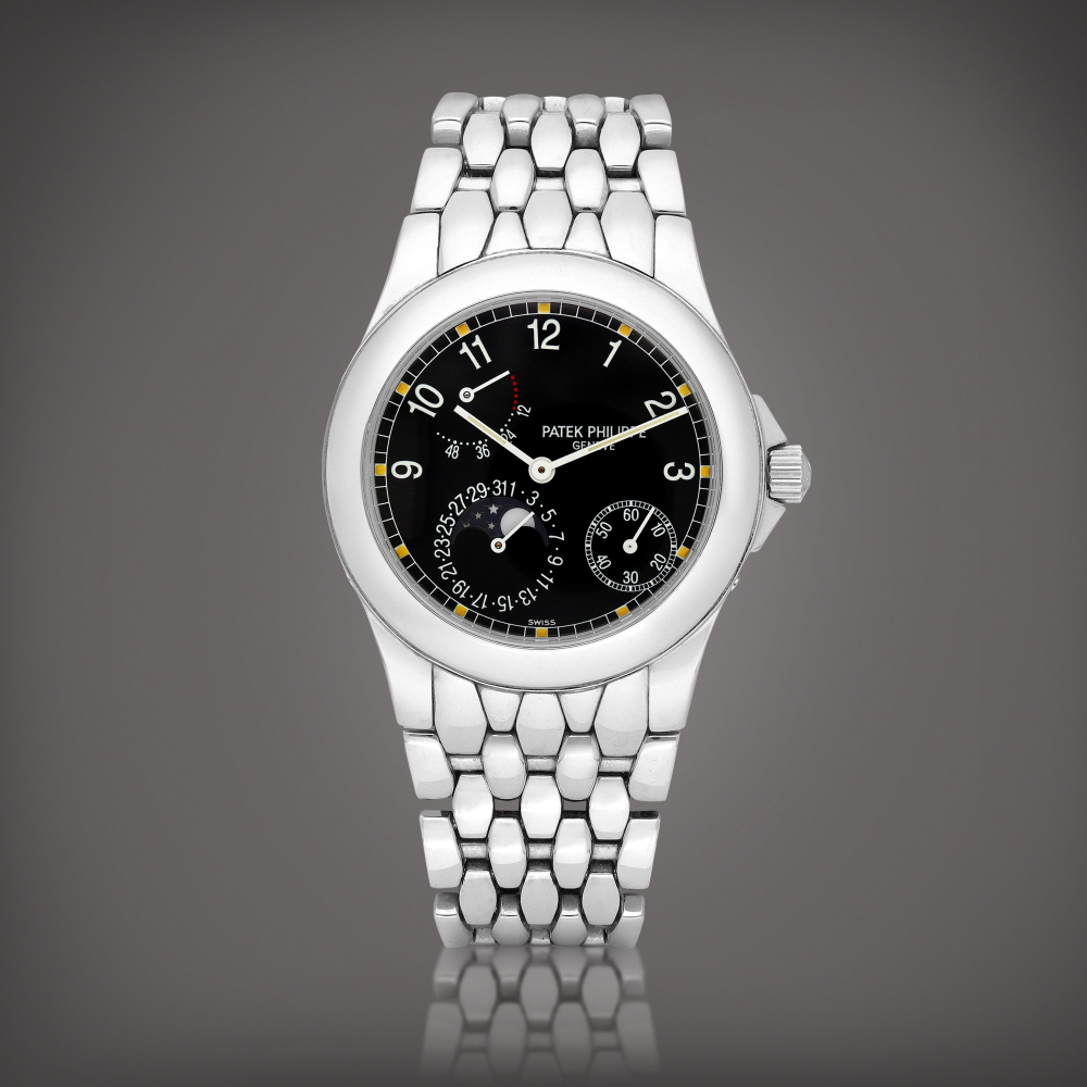 PROPERTY FROM A PROMINENT COLLECTOR  Patek Philippe  Neptune, Reference 5085 A stainless steel wristwatch with power reserve indication, moon phases and bracelet, Circa 2000 