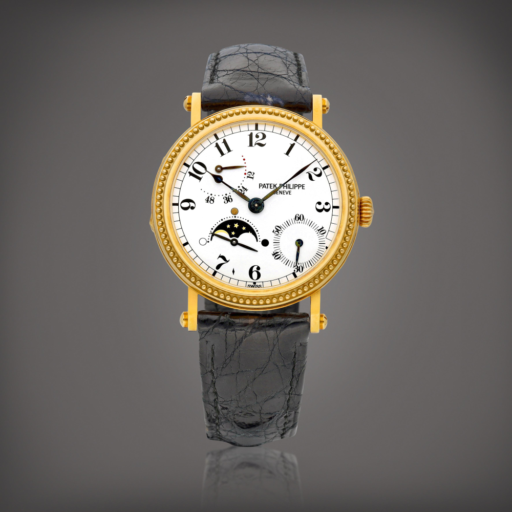 PROPERTY FROM A PROMINENT COLLECTOR  Patek Philippe  Reference 5015 A yellow gold wristwatch with moon phases and power reserve indication, Circa 1995 